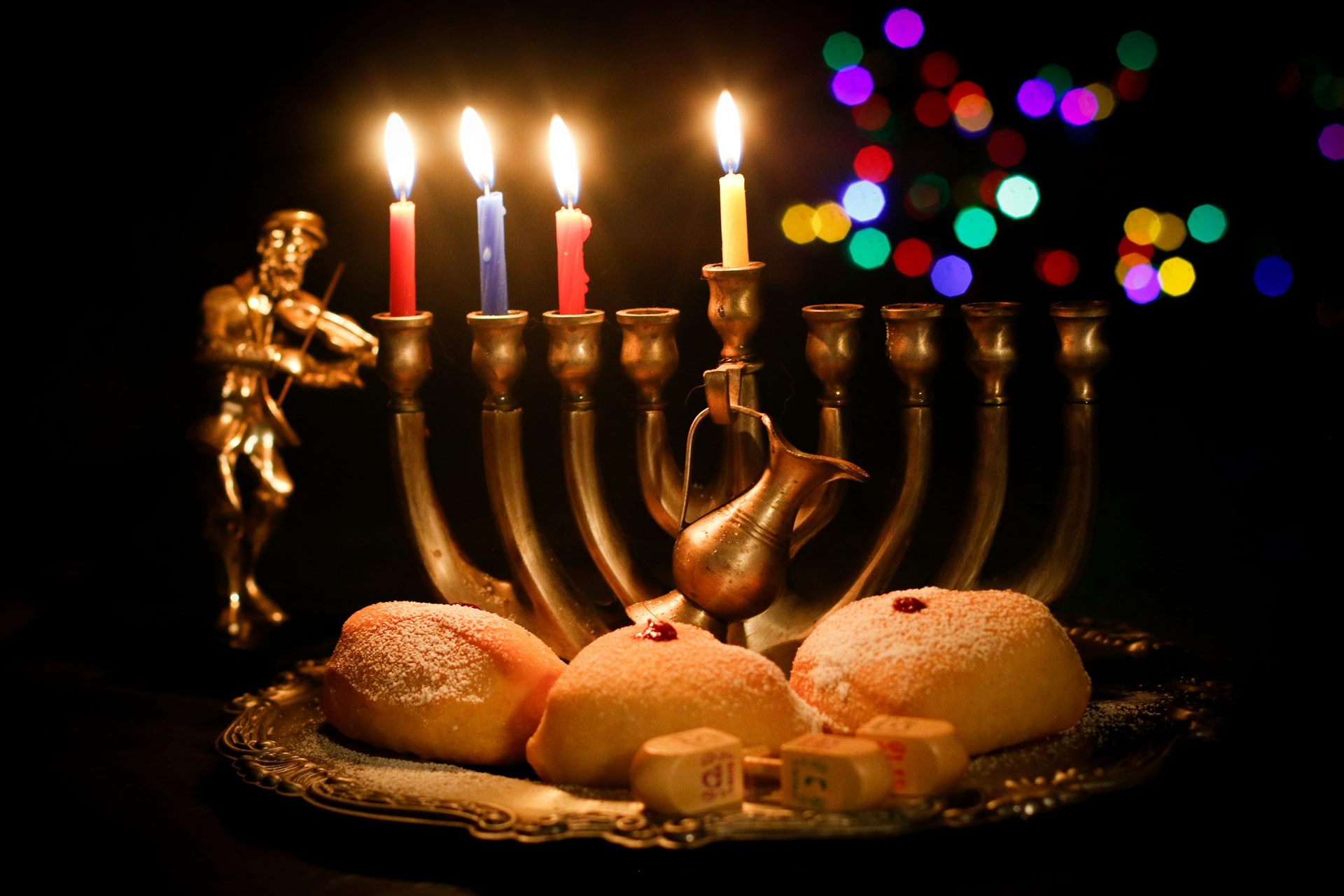 A Hanukkah menorah with its candles lit.