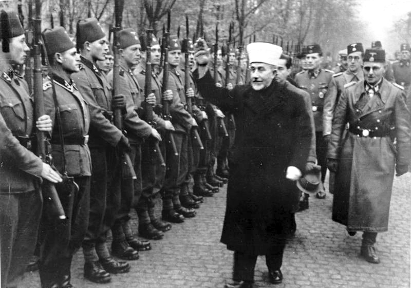 Amin al-Husseini in 1943 reviewing Bosnian Muslim volunteers of the Waffen-SS Handschar Division.
