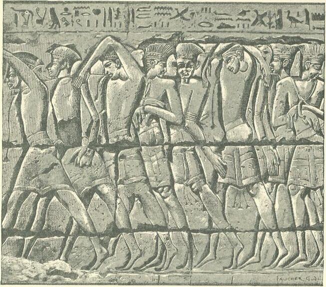 Line drawing of a carved Egyptian relief showing a procession of Philistine captives in feathered headdresses, from the temple of Ramesses III at Medinet Habu.