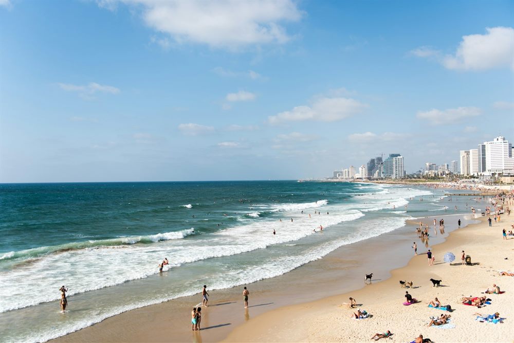 People on the Mediterranean beachfront in Tel Aviv.