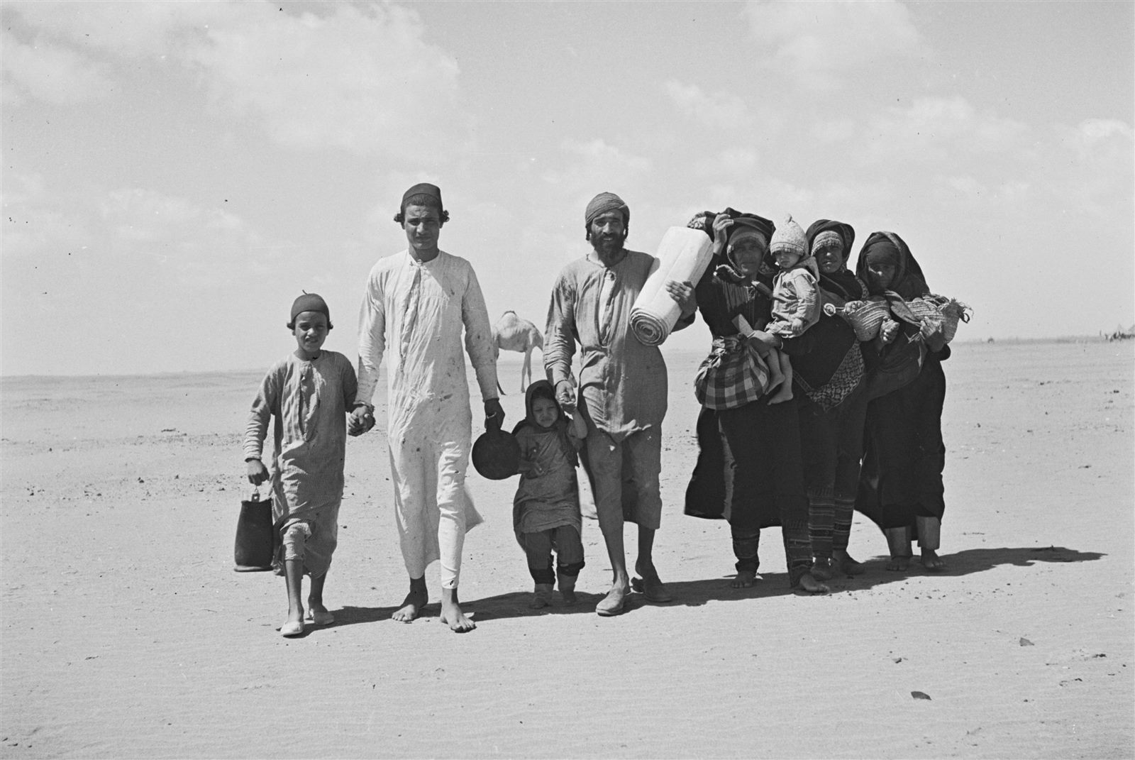 A Yemenite Jewish family walking across the desert toward Aden in 1949.